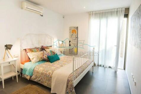 Dormitorio con terraza