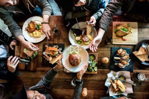 Friends all together at restaurant having meal