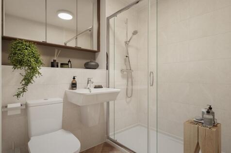 A stylish en suite shower room offers both comfort and privacy
