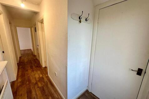 Hallway with storage cupboard