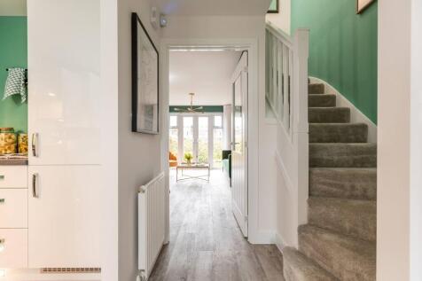 The Canford has a bright hallway with a convenient downstairs toilet