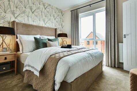 The king-size main bedroom has ample storage space