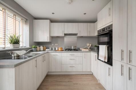 Watch the kids play from the light and airy kitchen