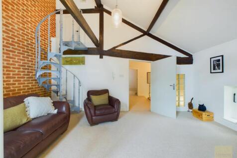 Living room with staircase to fourth floor