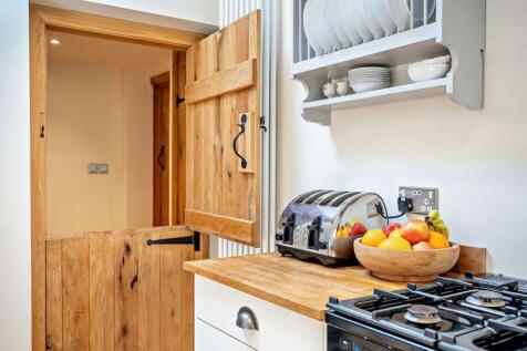 utility next to kitchen