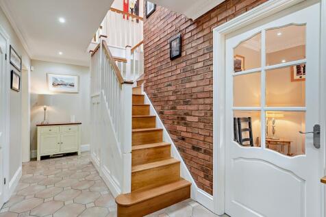 Hallway with feature exposed brick wall