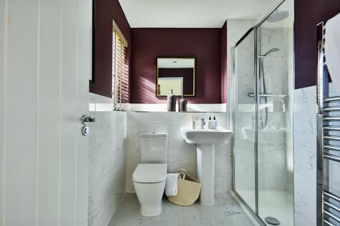 A private en-suite features in the main bedroom