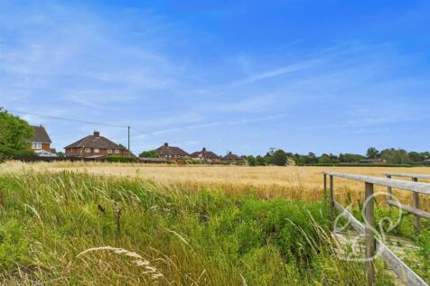 View of field looking towards back of property