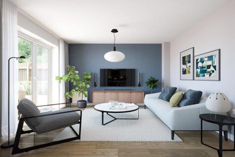 The family room is located off the kitchen/dining area and features French doors to garden