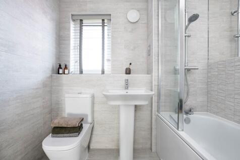 Bathroom with shower over bath - typical Taylor Wimpey home