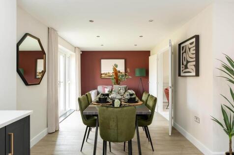 Double doors lead from the dining area to the garden, perfect for alfresco dining