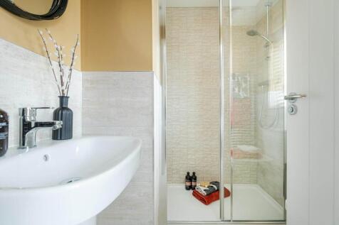 The main bedroom also hosts a private en-suite shower room