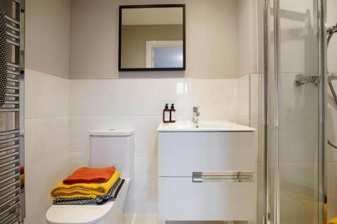 A private en-suite shower room leads off bedroom 1