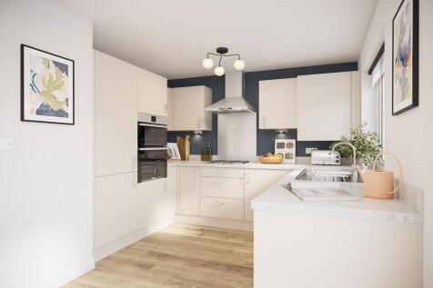 A modern kitchen area with ample storage
