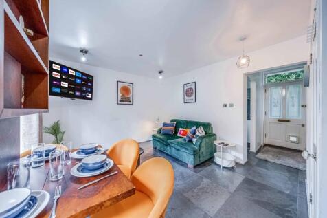 Bright and inviting living room featuring a com...
