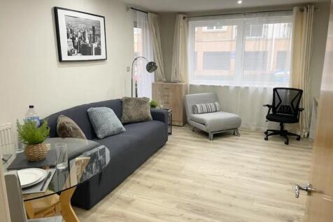 A spacious and inviting modern living room fill...