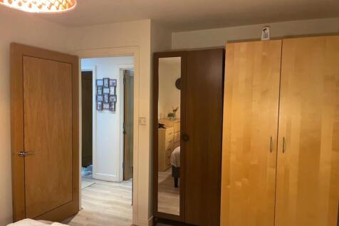 A bright and tidy double bedroom featuring ampl...