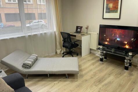 A modern living room with good natural light, f...