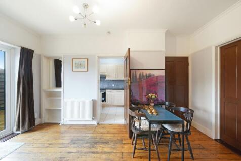 Bright and inviting living room featuring rusti...
