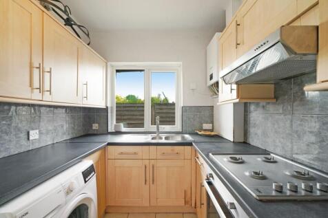 Bright and functional kitchen featuring ample c...