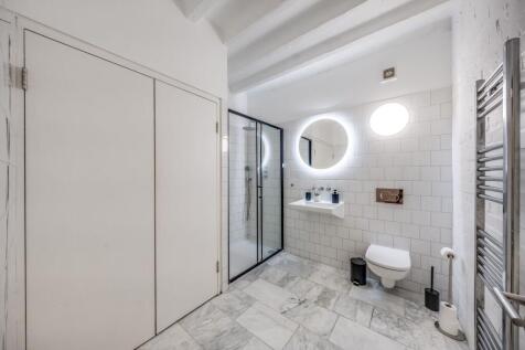 Experience a stylish and spacious bathroom suit...