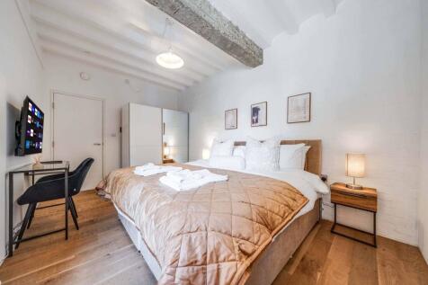 A beautifully designed double bedroom featuring...