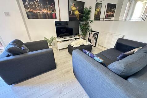 A modern living room featuring two comfortable ...