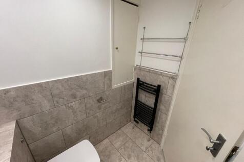A clean and well-maintained single toilet room ...