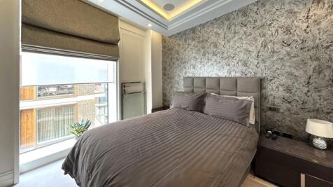 A stylish double bedroom featuring a comfortabl...