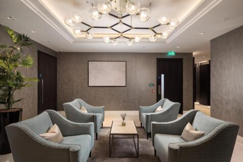 A stylish communal lounge featuring four comfor...