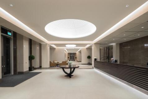 A spacious, modern reception area with elegant ...