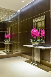 A stylish and modern reception area featuring a...