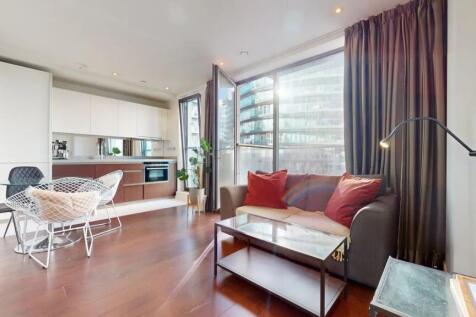 Bright and modern living room with floor-to-cei...