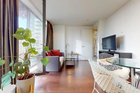 A modern and inviting living room featuring war...