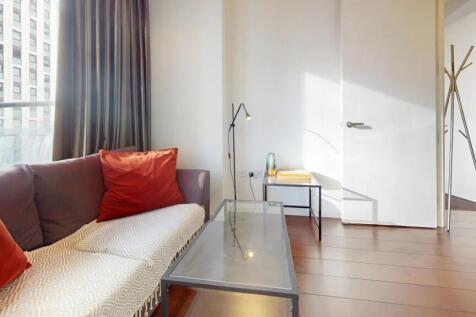 A bright and inviting living room featuring a c...