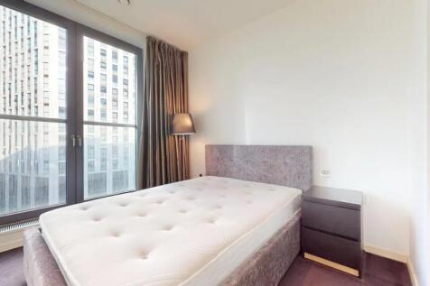 Bright and modern double bedroom featuring a co...