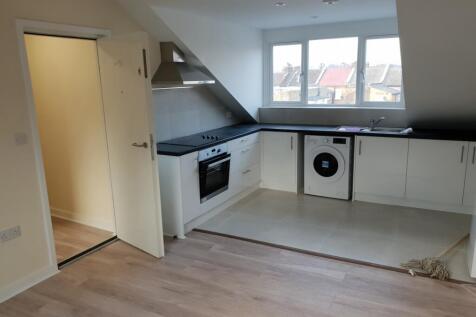 Bright and clean modern kitchen featuring sleek...