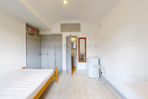 Bright and airy single bedroom featuring white ...