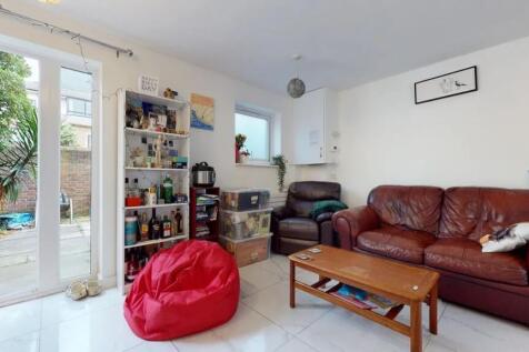 A cozy living room featuring comfortable leathe...