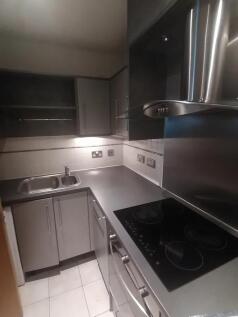 Sleek and modern kitchen featuring a smooth ele...