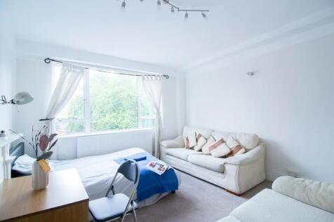 Bright and airy single bedroom featuring a larg...
