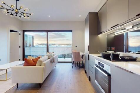 A stylish modern living room with an integrated...