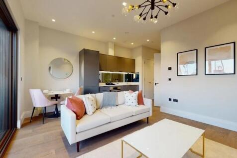 A stylish, contemporary living room featuring a...