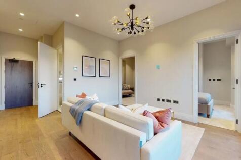 A modern and stylish living room featuring a co...