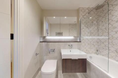 A modern and stylish bathroom suite featuring e...