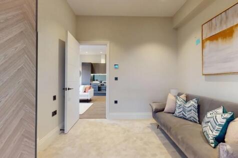 Contemporary living room featuring a plush grey...