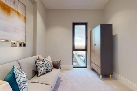 A stylish and modern living room featuring a co...