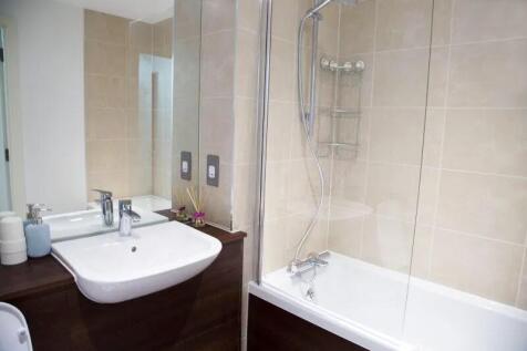 A clean and modern bathroom suite featuring a w...