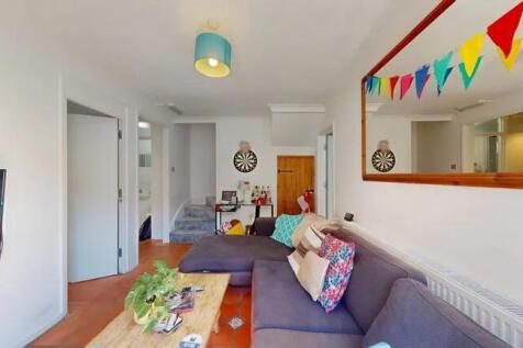 A cozy living room featuring a comfortable sect...