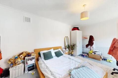 Bright and cozy double bedroom featuring a comf...
